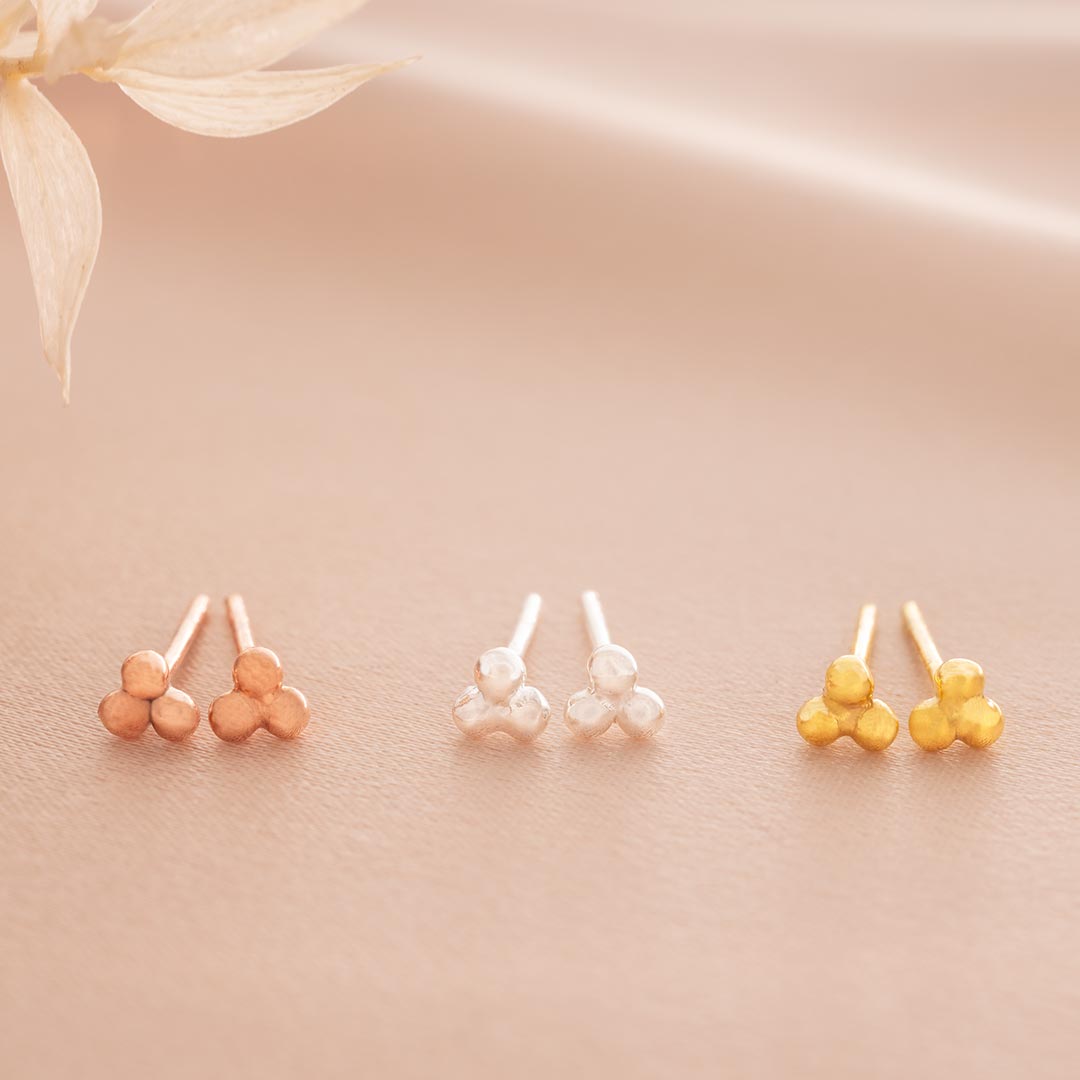 triple stud earrings available in three colourways, sterling silver, rose gold plated sterling silver and gold plated sterling silver