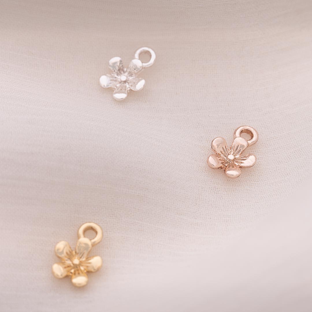 6mm flower charm for jewellery making available in three colours; silver, rose gold and champagne gold