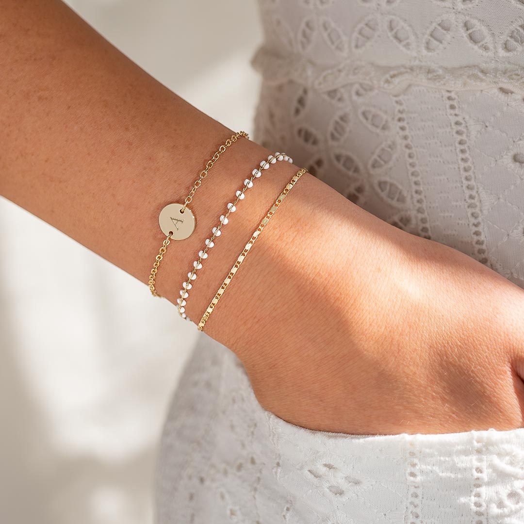 champagne gold plated initial disc and layered bead bracelet
