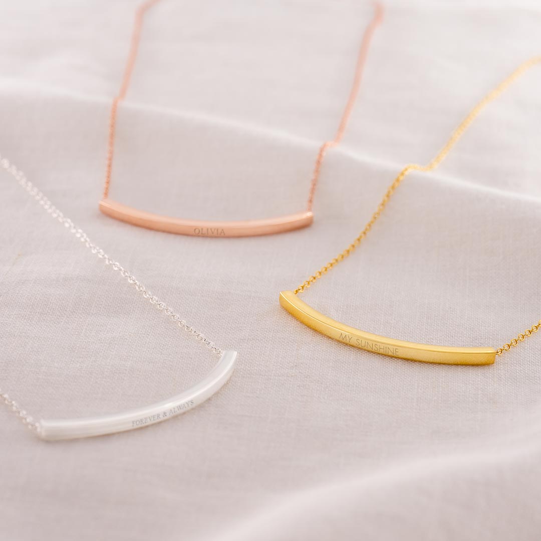 gold plated sterling silver hidden messaged curved skinny bar necklace